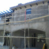 Stucco Scratch coat at rear of West L.A. house, with deep porch off kitchen.